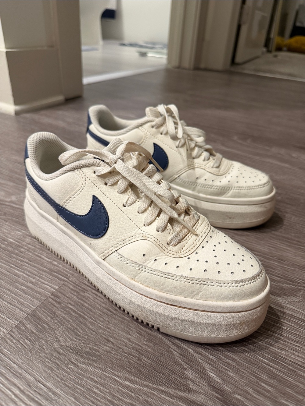 Nike Cream Platform Sneakers with Blue Swoosh